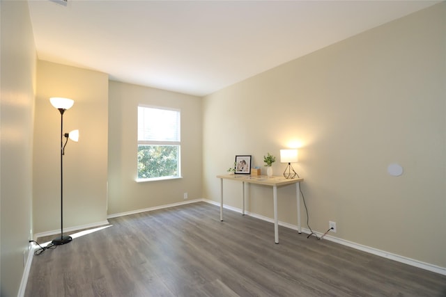 spare room featuring dark hardwood / wood-style flooring