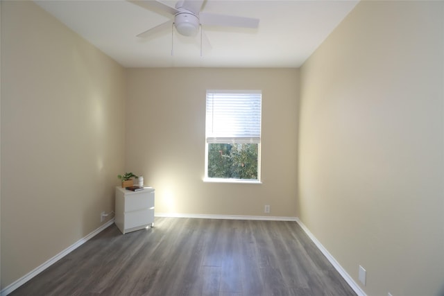 spare room with ceiling fan and dark hardwood / wood-style floors