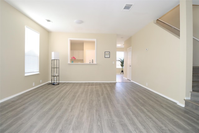 unfurnished living room featuring wood-type flooring