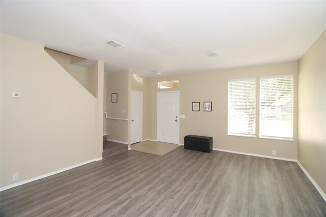 empty room with dark wood-type flooring