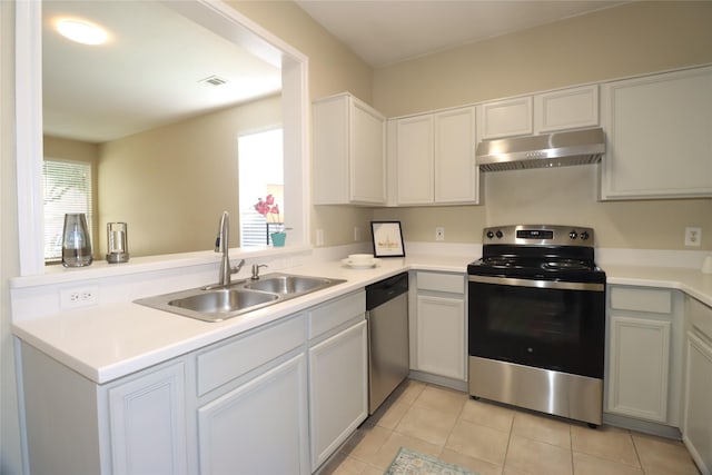 kitchen featuring kitchen peninsula, sink, light tile patterned floors, and stainless steel appliances