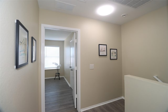 hallway with dark hardwood / wood-style flooring