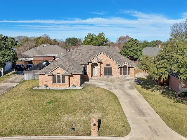 ranch-style home with a front yard