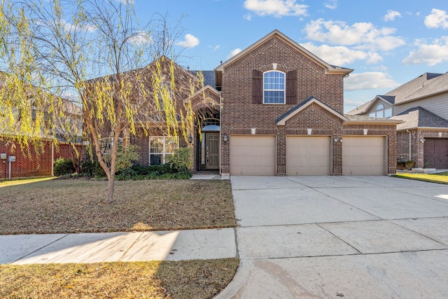 view of property with a garage and a front yard