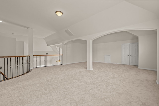 bonus room featuring lofted ceiling and carpet floors