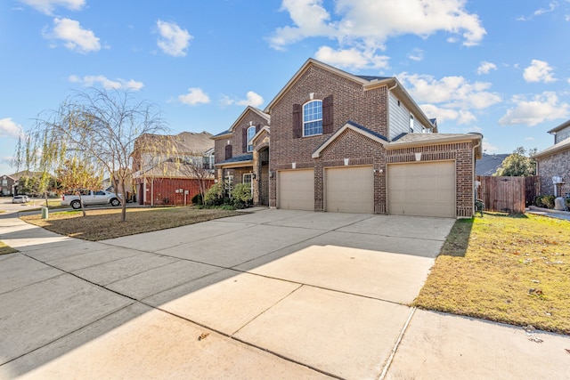 view of property featuring a front lawn and a garage