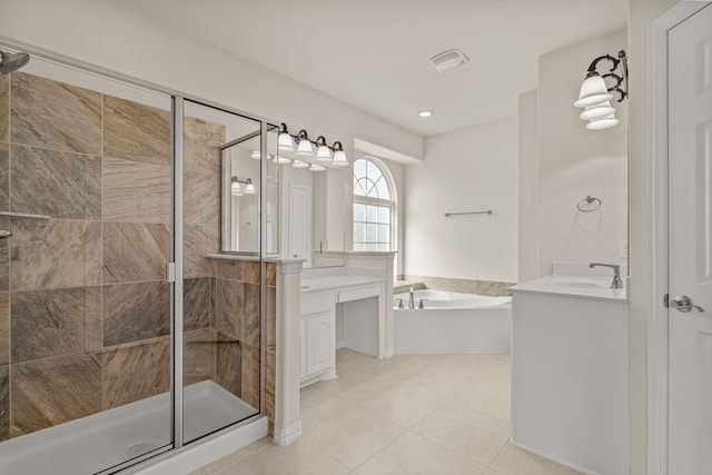 bathroom with tile patterned floors, vanity, and shower with separate bathtub