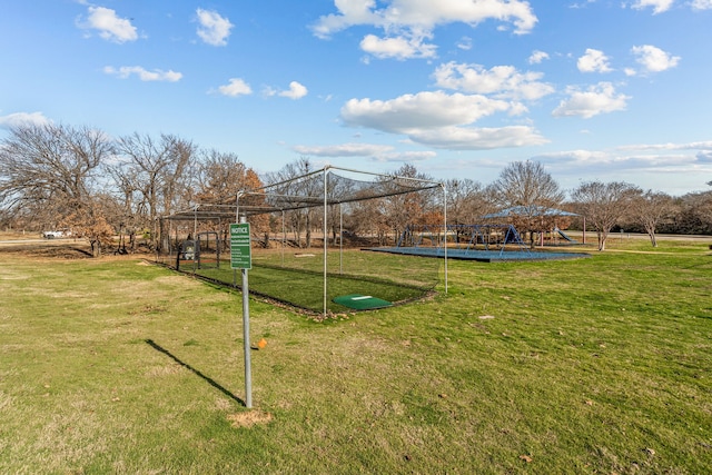 surrounding community with a yard and a playground