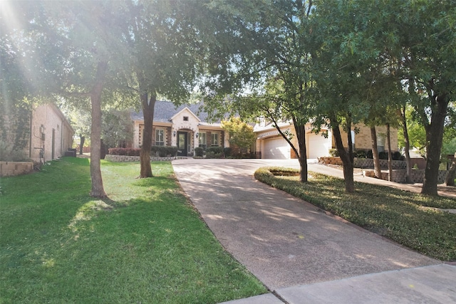 ranch-style home with a garage and a front yard