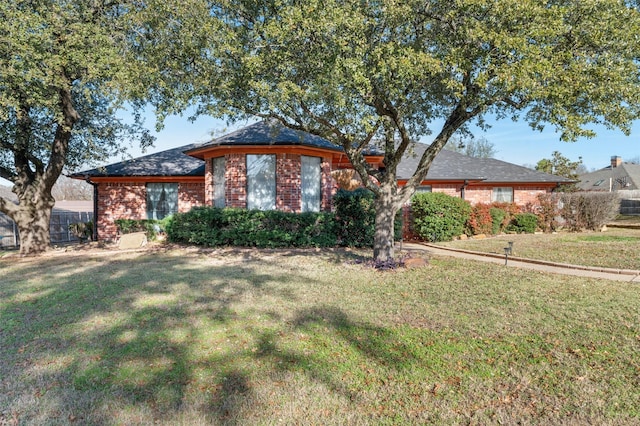 ranch-style house with a front lawn