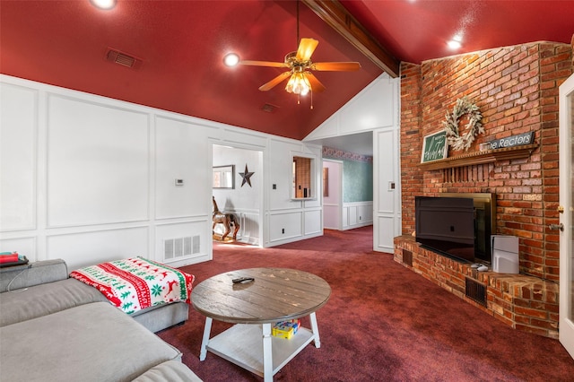 living room with ceiling fan, lofted ceiling with beams, and dark carpet