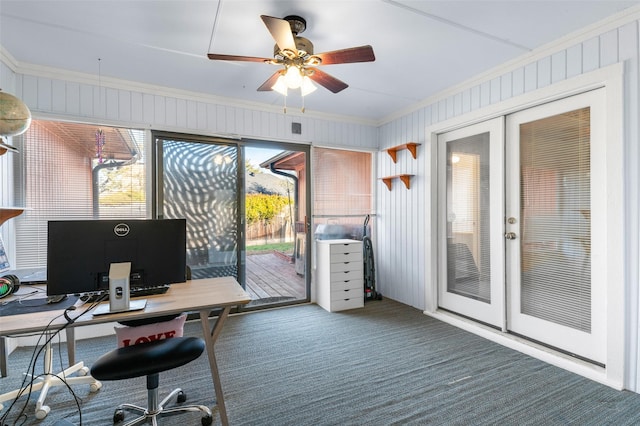 office space featuring french doors, dark carpet, ceiling fan, and crown molding