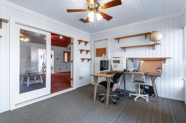 home office featuring ceiling fan, dark carpet, and ornamental molding