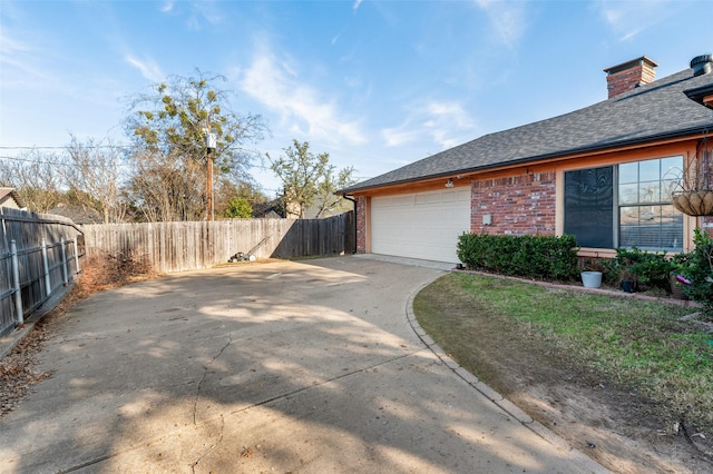 view of side of property with a garage