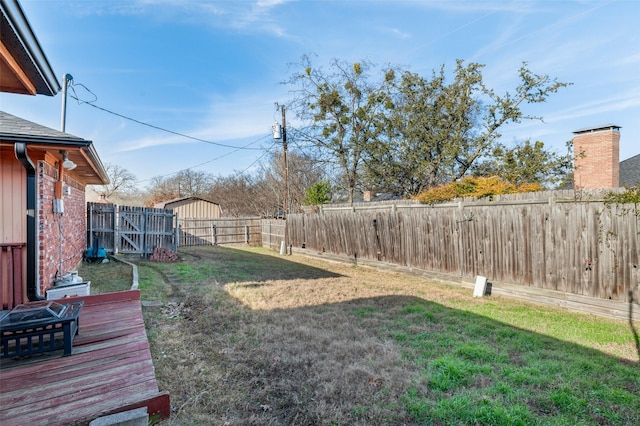 view of yard with an outdoor fire pit