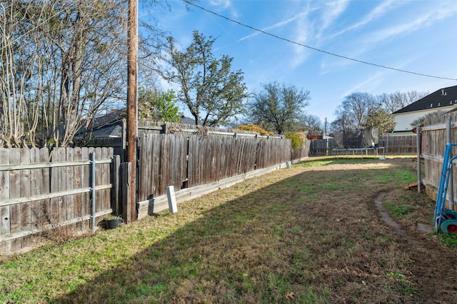 view of yard with a trampoline