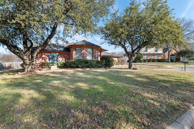 ranch-style house with a front yard