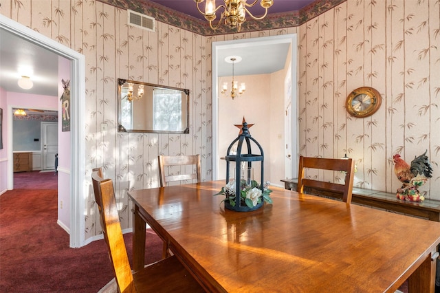 carpeted dining area with an inviting chandelier