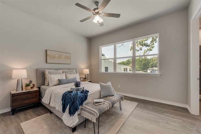 bedroom featuring hardwood / wood-style floors and ceiling fan