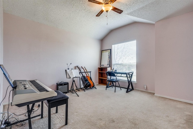 miscellaneous room featuring a textured ceiling, light colored carpet, vaulted ceiling, and ceiling fan