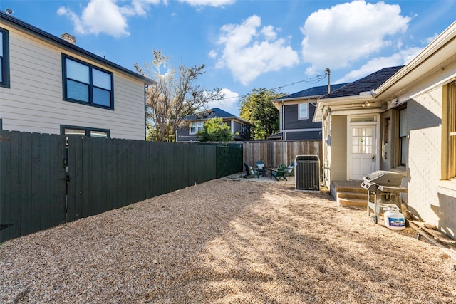 view of yard with central AC