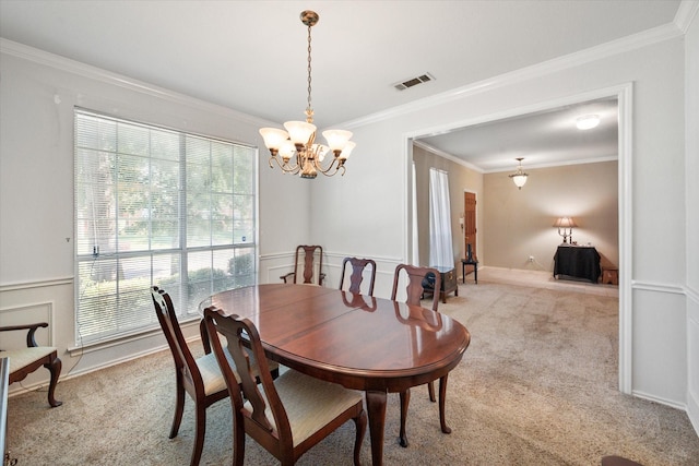 dining room featuring a notable chandelier, light colored carpet, and crown molding