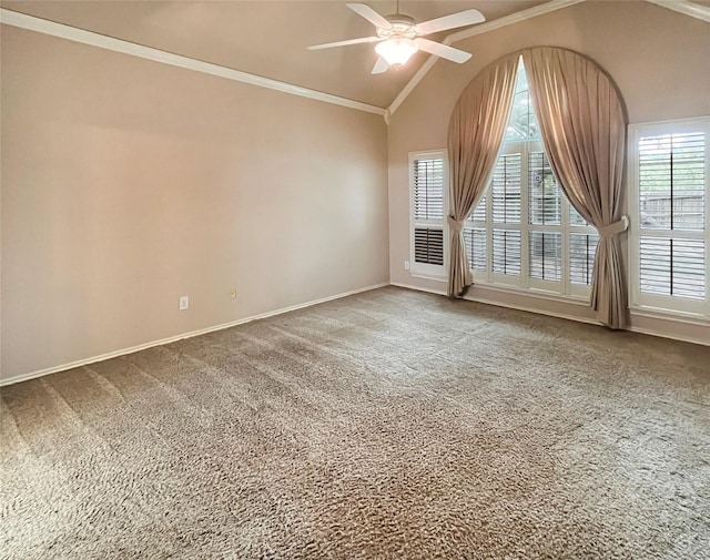 carpeted empty room featuring ceiling fan, crown molding, and vaulted ceiling