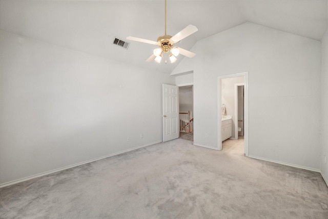 unfurnished bedroom featuring light carpet, ensuite bathroom, high vaulted ceiling, and ceiling fan