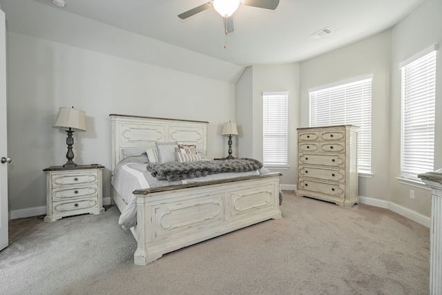 carpeted bedroom featuring ceiling fan and lofted ceiling