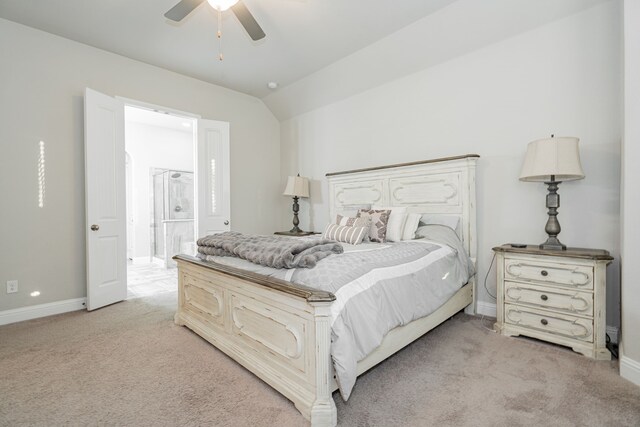 carpeted bedroom featuring ceiling fan and vaulted ceiling