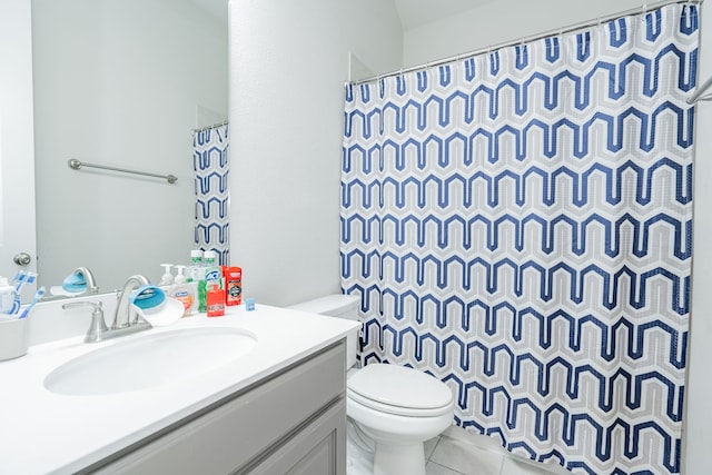 bathroom with tile patterned floors, vanity, a shower with shower curtain, and toilet