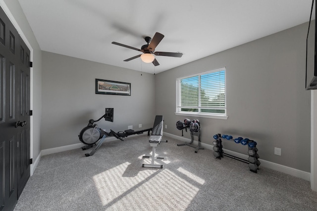 workout room with light carpet and ceiling fan