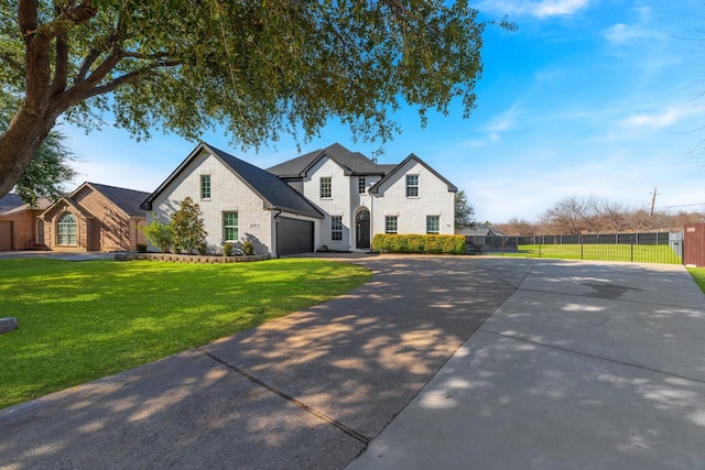 view of front facade featuring a front lawn and a garage