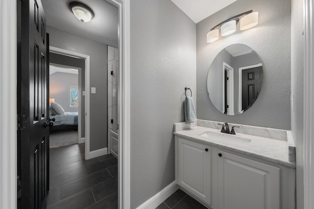 bathroom featuring tile patterned floors and vanity