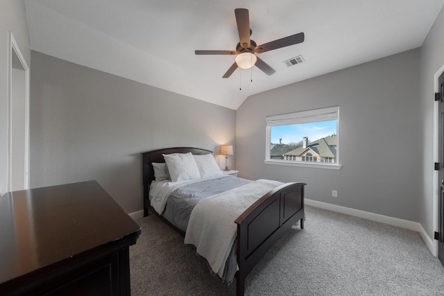 carpeted bedroom featuring ceiling fan and vaulted ceiling