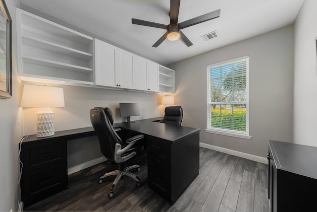 home office featuring ceiling fan and dark hardwood / wood-style flooring