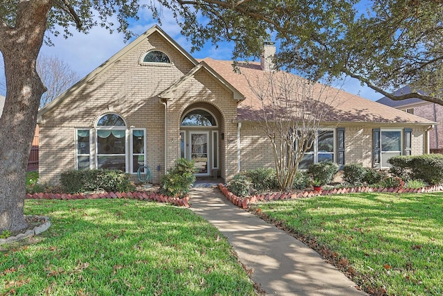 view of front of home with a front yard