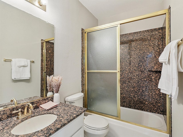 full bathroom featuring vanity, toilet, and enclosed tub / shower combo