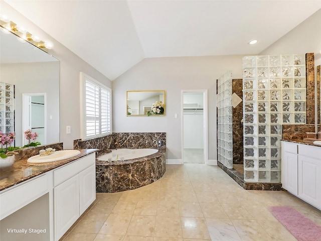 bathroom featuring separate shower and tub, tile patterned flooring, vanity, and vaulted ceiling