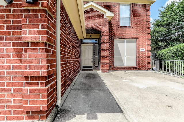 entrance to property with a patio