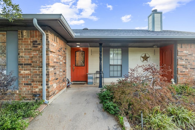 property entrance featuring a porch