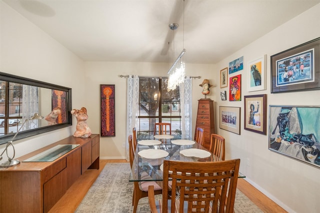 dining area with light hardwood / wood-style floors