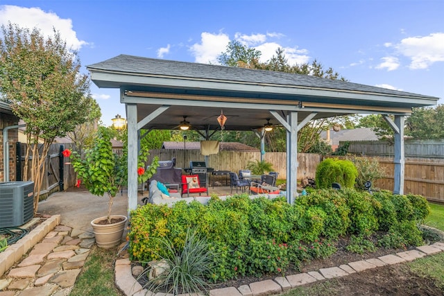 view of patio featuring a gazebo, a grill, ceiling fan, and central air condition unit