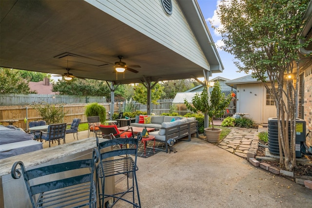 view of patio / terrace featuring cooling unit, an outdoor living space, and ceiling fan