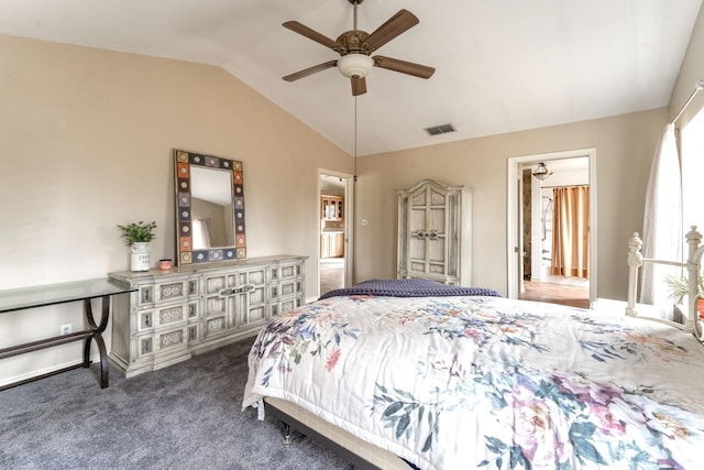 carpeted bedroom with ceiling fan and vaulted ceiling