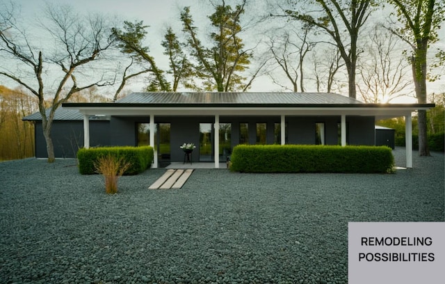 view of front of house featuring covered porch and metal roof