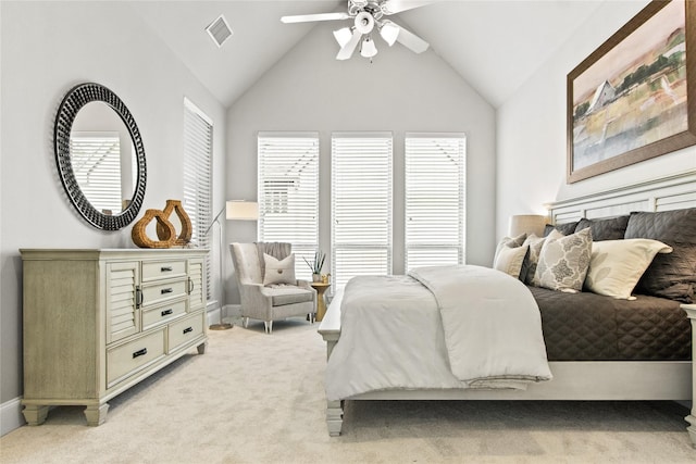 carpeted bedroom with ceiling fan and lofted ceiling