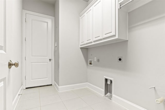 laundry area with hookup for an electric dryer, hookup for a washing machine, cabinets, gas dryer hookup, and light tile patterned flooring