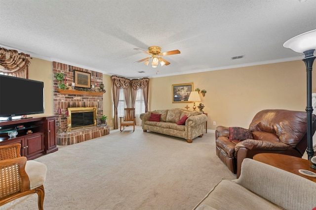 carpeted living room with crown molding, ceiling fan, a textured ceiling, and a fireplace