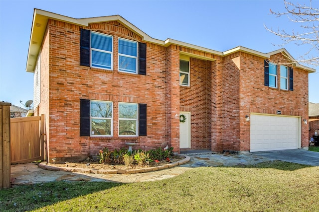 view of front of house featuring a garage and a front lawn